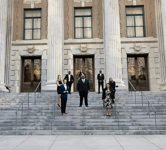 Sulli Martinez team on courthouse exterior